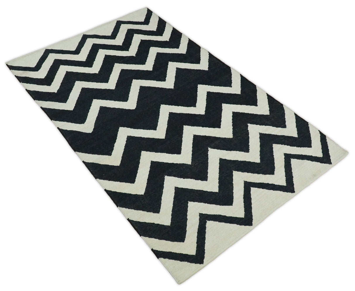 Black and Beige Outdoor Safe Hand Woven Dhurrie Rug Chevron Pattern