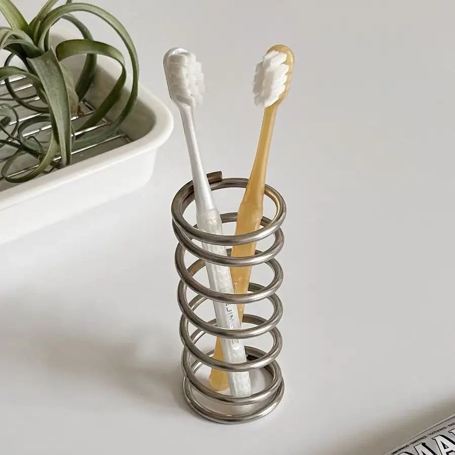 Spring Toothbrush Holder